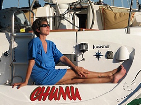 Ann Angle relaxing on the swim platform of our Jeanneau 37